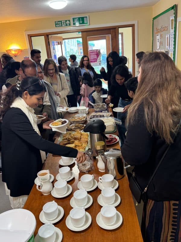 GCA members and families sharing food at a community gathering